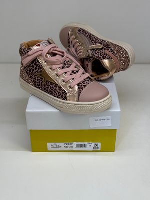 pink and gold sneakers with leopard print on them on a box