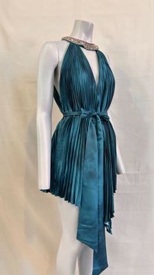 an image of a mannequin dressed in a teal dress