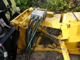 a yellow machine that is sitting on the ground