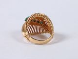 an image of a gold ring with turquoise stones on it