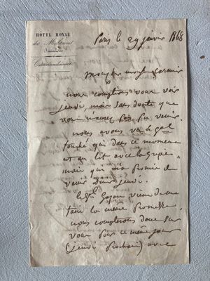 a piece of paper with writing on it sitting on top of a table