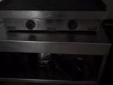 a black and white photo of a gas stove