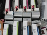 boxes of cell phones are stacked on top of each other on a table