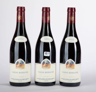 three bottles of wine sitting on top of a white table