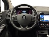 the interior of a car with a steering wheel and dashboard controls