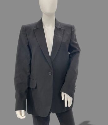 a mannequin dressed in a black suit and white shirt
