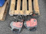 a pair of shoes that are on the ground next to a pallet