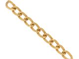 a close up of a gold bracelet on a white background