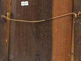an old picture frame with a rope hanging from it ' s side