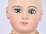 a close up of a doll with a bald head