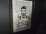 a framed picture of a man with a beard and a bow tie