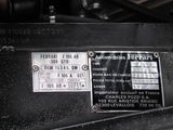 a close up of a car ' s engine label on the side of the vehicle