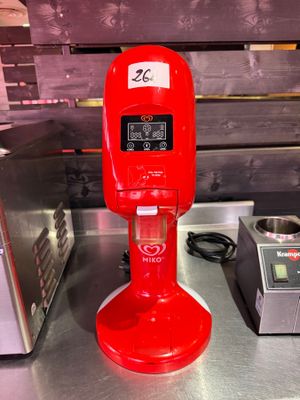 a red coffee maker sitting on a counter next to a toaster and a toaster