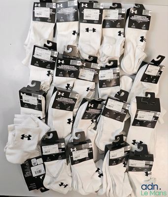 several pairs of white socks are stacked on top of each other