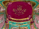 a decorative box with a painting on it on a table