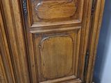 a wooden cabinet that has a clock on it