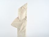 a stone sculpture of a man ' s head on a table