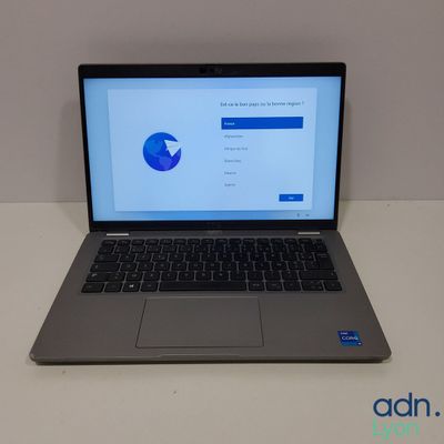 an open laptop computer sitting on top of a white table