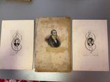 three old photos of a man and a woman are on a table