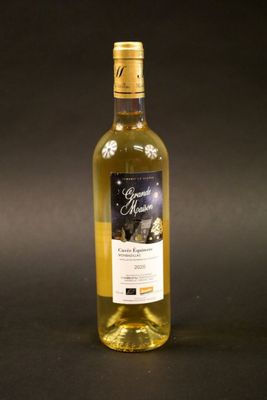 a bottle of wine that is sitting on a table