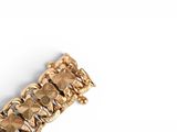 bracelet on a white surface with a white background