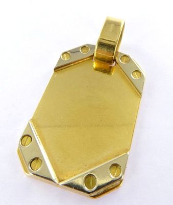 an image of a gold plated pendant with holes in the middle