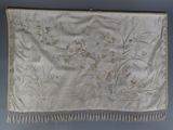 an antique silk embroidered wall hanging with flowers and birds on it