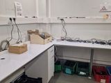 a lab with a lot of work on the counter