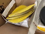 a box of yellow discs and a box of black discs