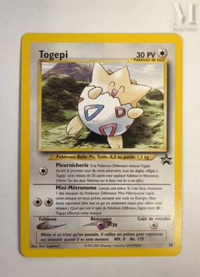 a close up of a pokemon card on a white surface