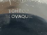 a close up of a black plate with a name on it