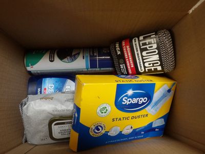a cardboard box with various cleaning products in it