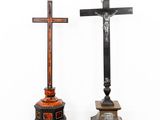 two wooden crosses are standing next to each other in a room