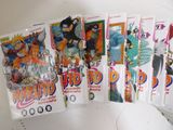 a lot of dragon ball trading cards on the table