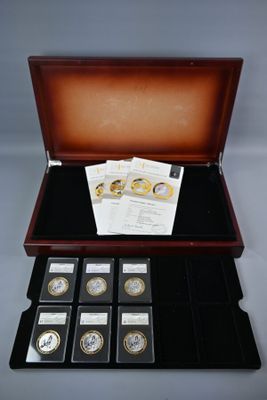 une image représentant un coffret en bois contenant six pièces différentes
