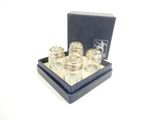 a small box with four small glass bottles in it