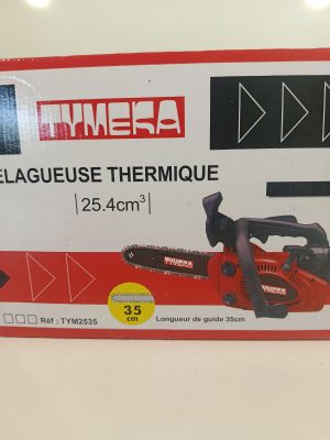 the box of a chainsaw is sitting on the table