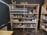 a wooden shelf with various items on it in a store