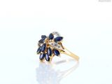 an image of a diamond and sapphire flower ring