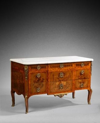 an antique chest of drawers with marble top and brass handles