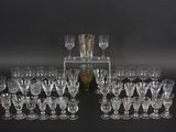a lot of glasses that are sitting on a table