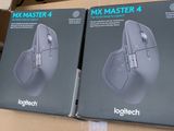 two boxes of computer mouses sitting on top of a cardboard box