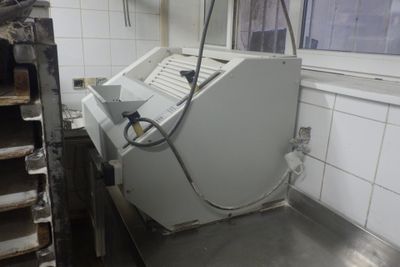 a machine that is sitting in a kitchen next to a window