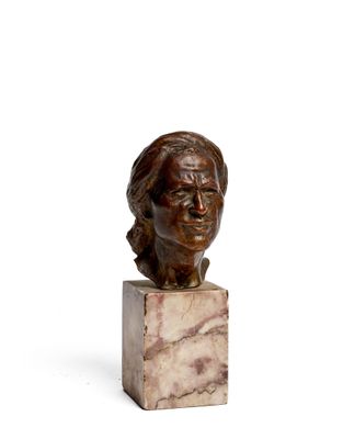 statue of a woman ' s head on a marble block