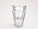 a clear glass cup sitting on top of a table