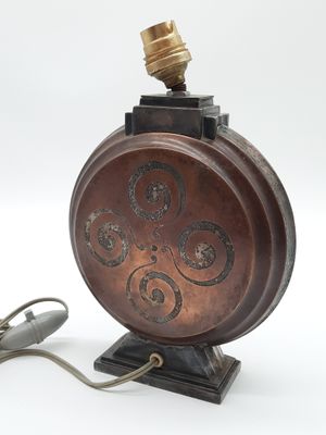 a lamp that is sitting on a stand with a cord