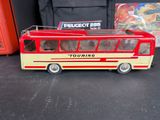 a toy bus that is sitting on a table
