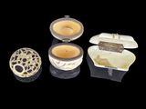 several different types of candles are shown on a black surface