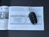 a car key on a piece of paper next to a car key