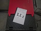 a piece of paper sitting on top of a red box